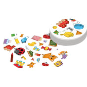 A "Dobble Kids" társasjáték kártyái, amelyek vidám illusztrációkat tartalmaznak.