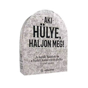 Az Aki hülye, haljon meg! társasjáték sírkő formájú doboza, fekete felirattal és vicces haláltematikával.