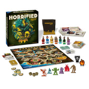 A "Horrified: American Monsters" társasjáték tartozékai, beleértve a táblát, karakterfigurákat és kártyákat.