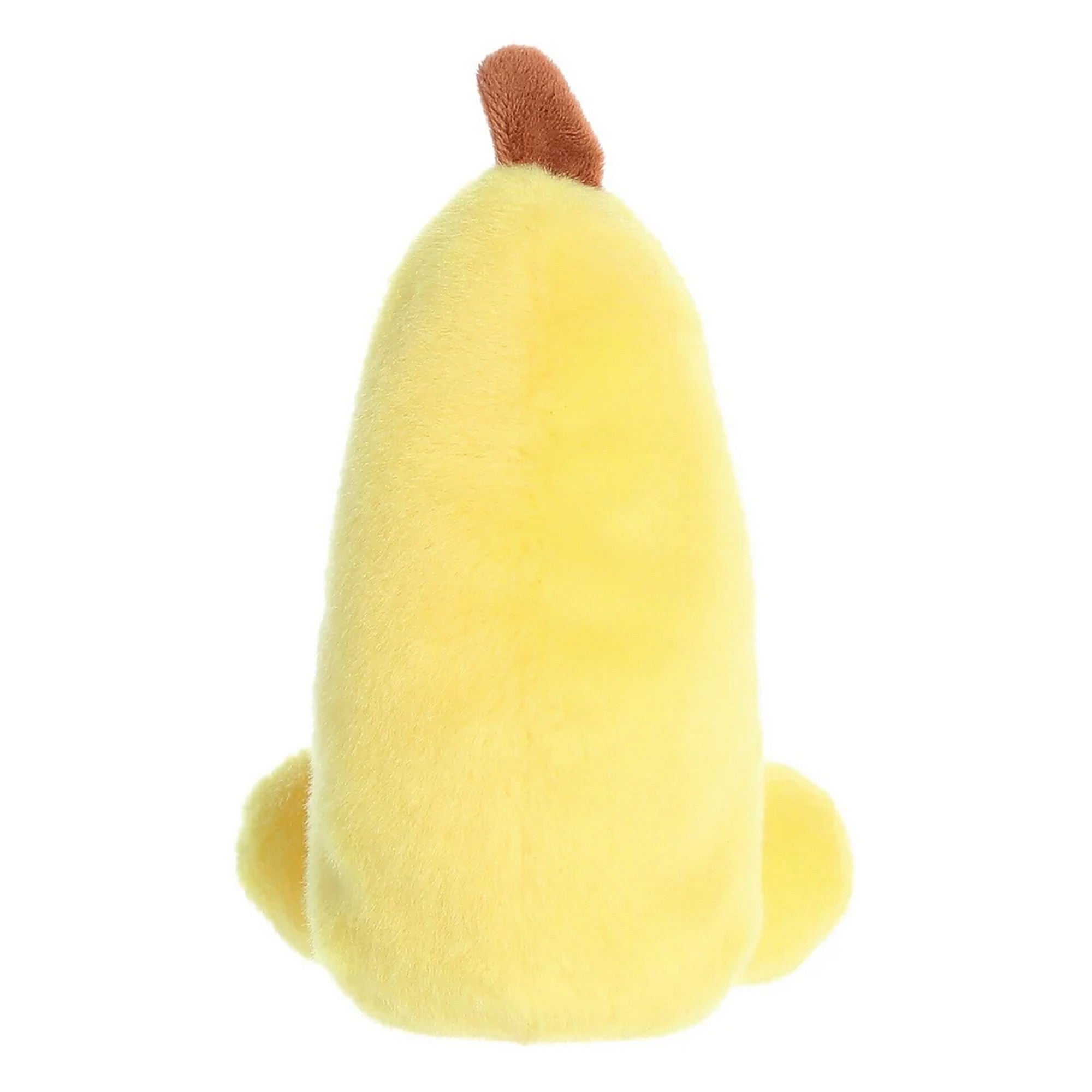 Banán plüss játék hátulról, egyszínű sárga, bolyhos felülettel és lekerekített formával, puha tapintású kivitelben