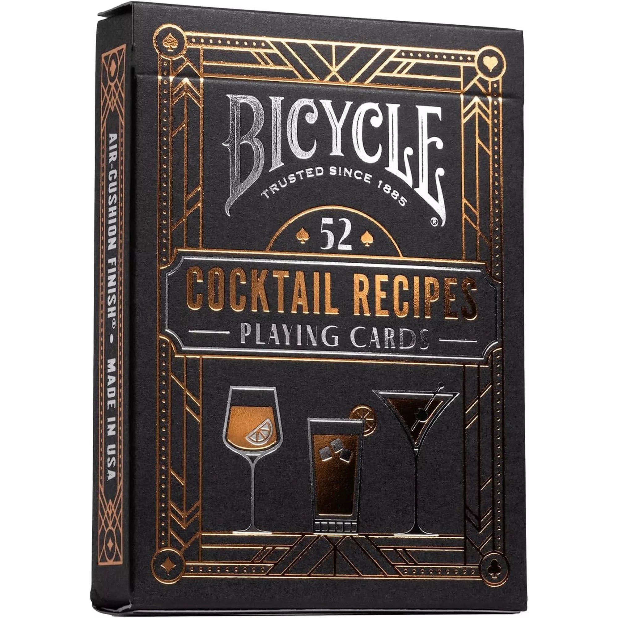 A Bicycle 52 Cocktail Recipes kártyapakli doboza fekete és bronz színekben, art deco stílusban, koktélpoharak illusztrációival és fényes felirattal díszítve.