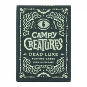 Campy Creatures Dead Luxe playing cards doboz, sötét alapon világító hatású díszítéssel, koponya- és szemmotívumokkal.
