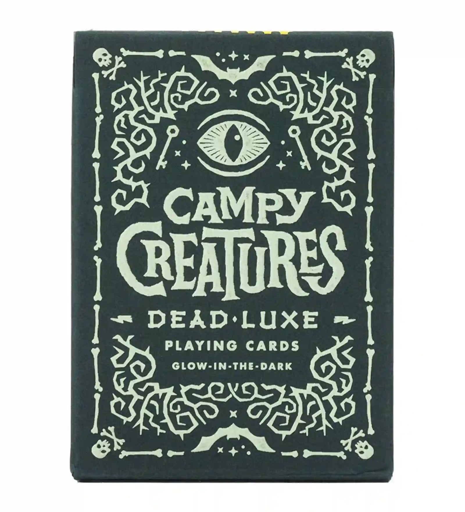 Campy Creatures Dead Luxe playing cards doboz, sötét alapon világító hatású díszítéssel, koponya- és szemmotívumokkal.