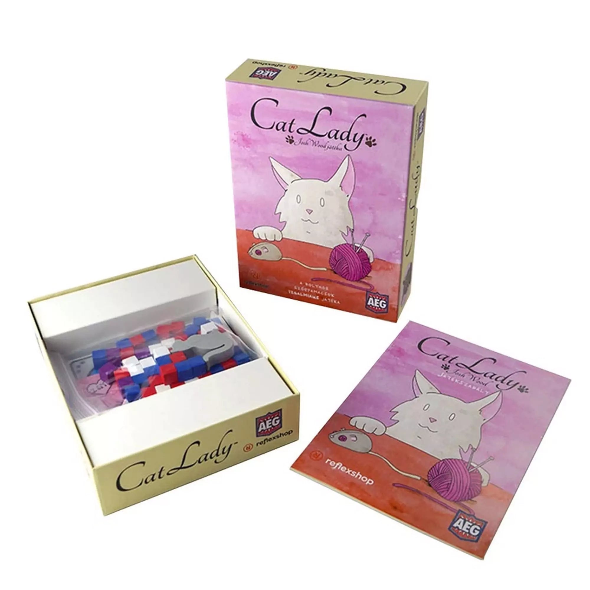 A Cat Lady játék kártyái, kockái és szabálykönyve rendezett dobozban.
