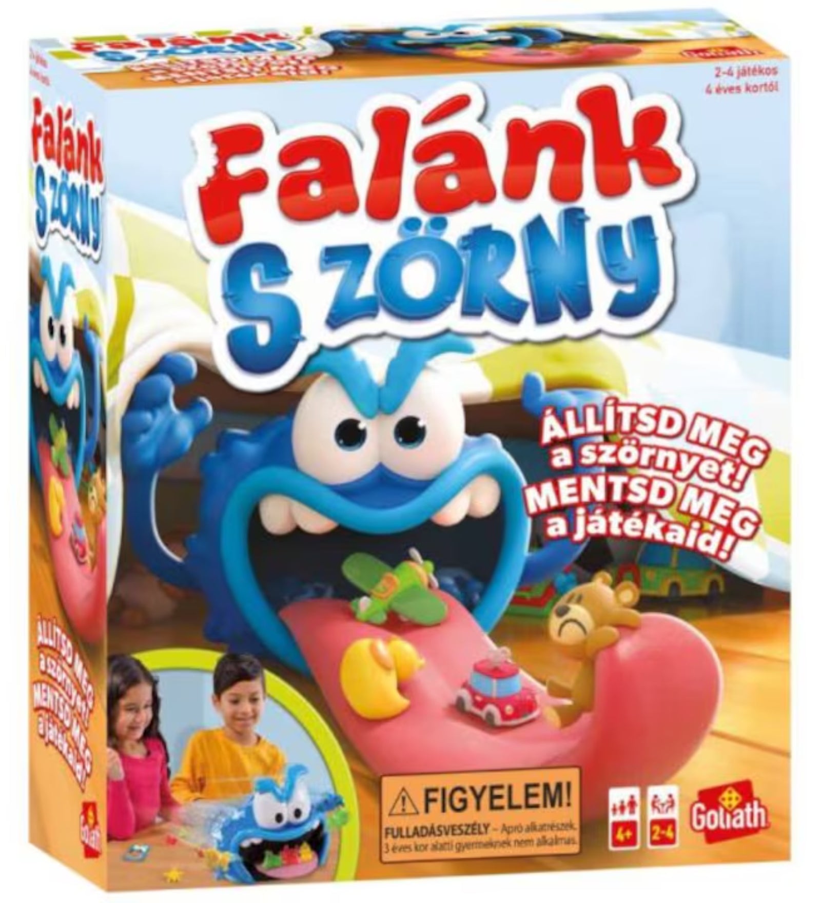 A Goliath Falánk Szörny doboza, amelyen a kék szörny játékfigurákat nyel el, gyerekekkel a játék közben.