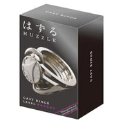 A Huzzle Cast RING II doboza elegáns fekete háttérrel, rajta a kirakó képe és a nehézségi szintet jelző öt csillag.