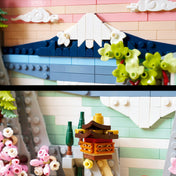 LEGO Art Japanese Cherry Blossom Landscape (31218) készlet részletfotó, hegyekkel, felhőkkel és virágzó növényekkel kialakított dekoratív jelenettel.