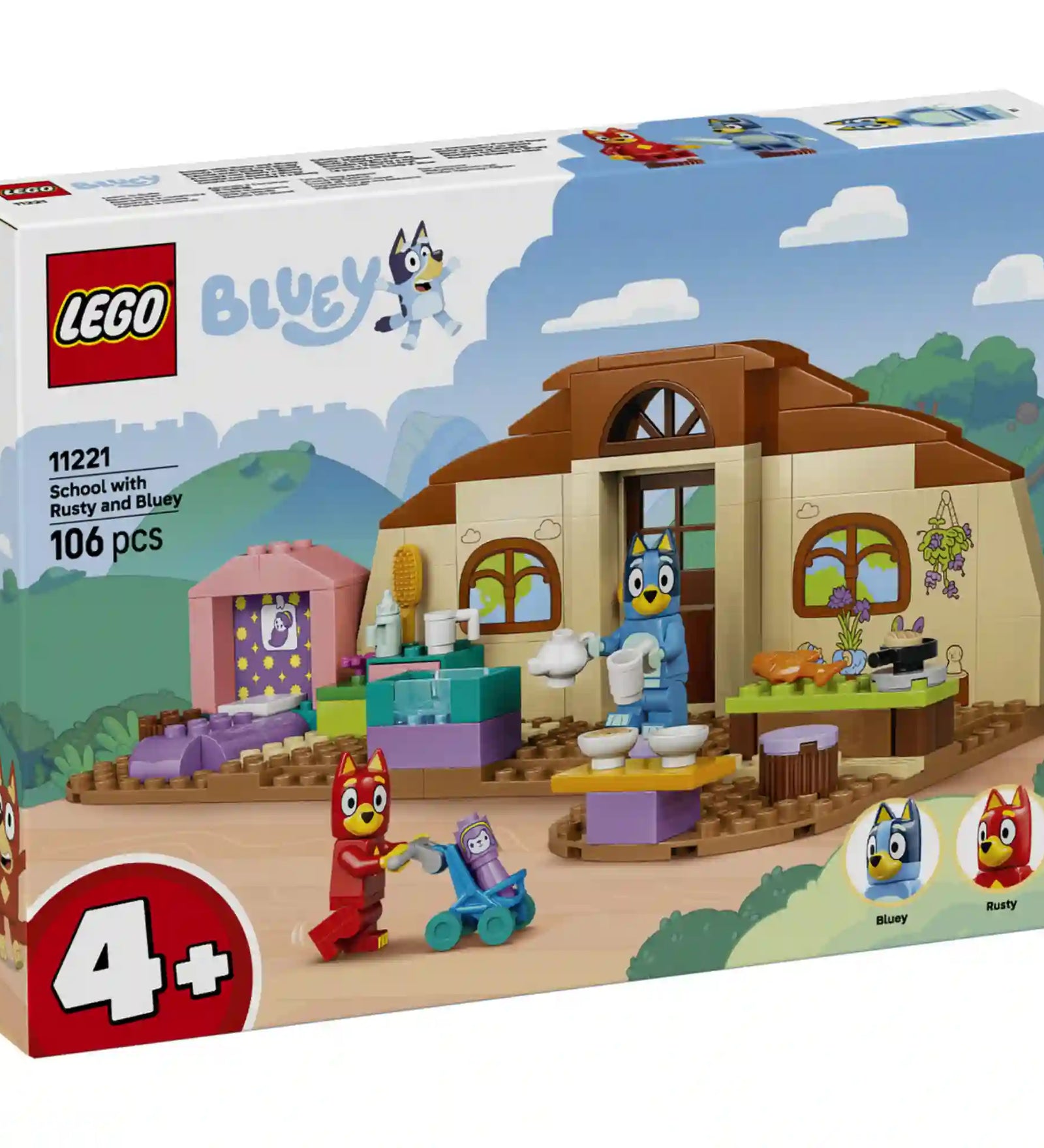 LEGO Bluey: Iskola Blueyval és Rustyval (11221) dobozképe, amely bemutatja az iskolaépületet, Bluey és Rusty karaktereket, valamint a kreatív szerepjátékhoz használható tantermi elemeket.