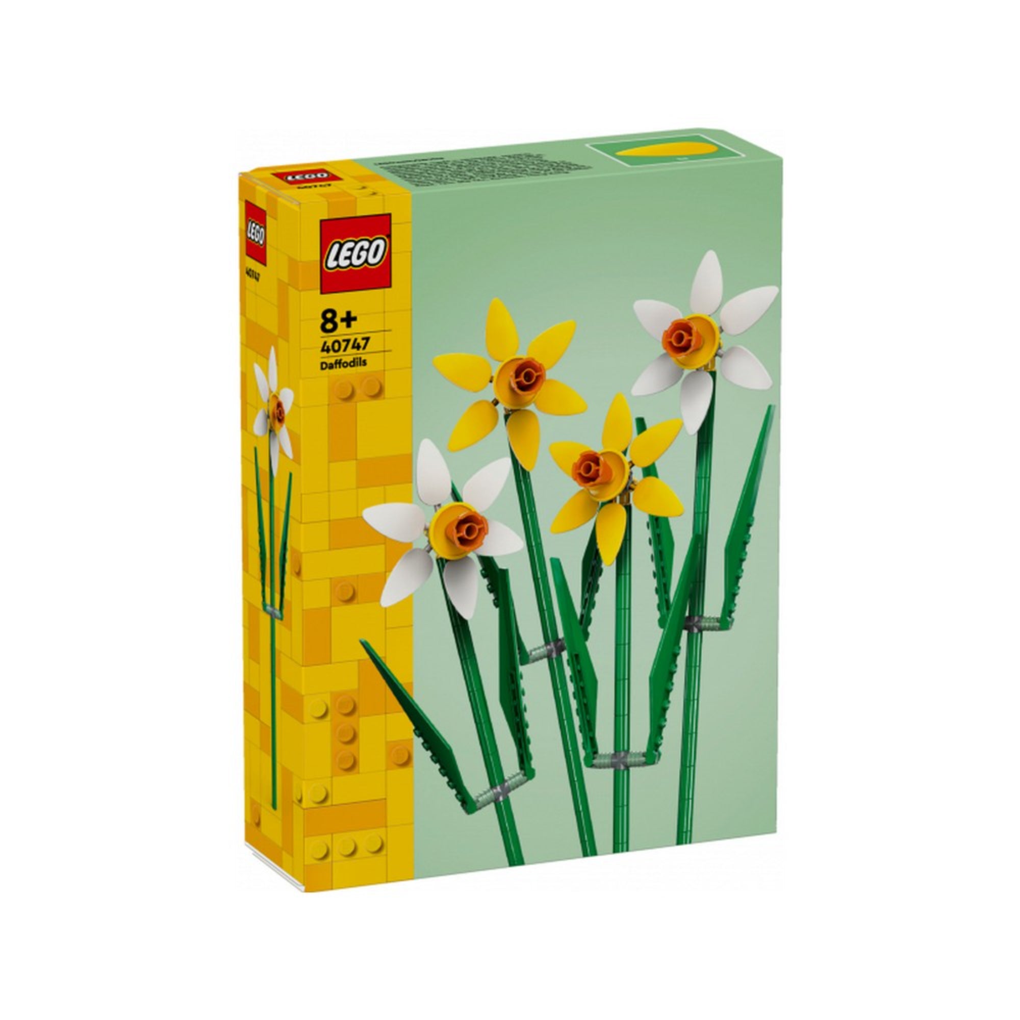 „LEGO Nárciszok (40747) készlet doboza négy, hosszú szárú, sárga és fehér LEGO nárcisszal zöld háttér előtt.”