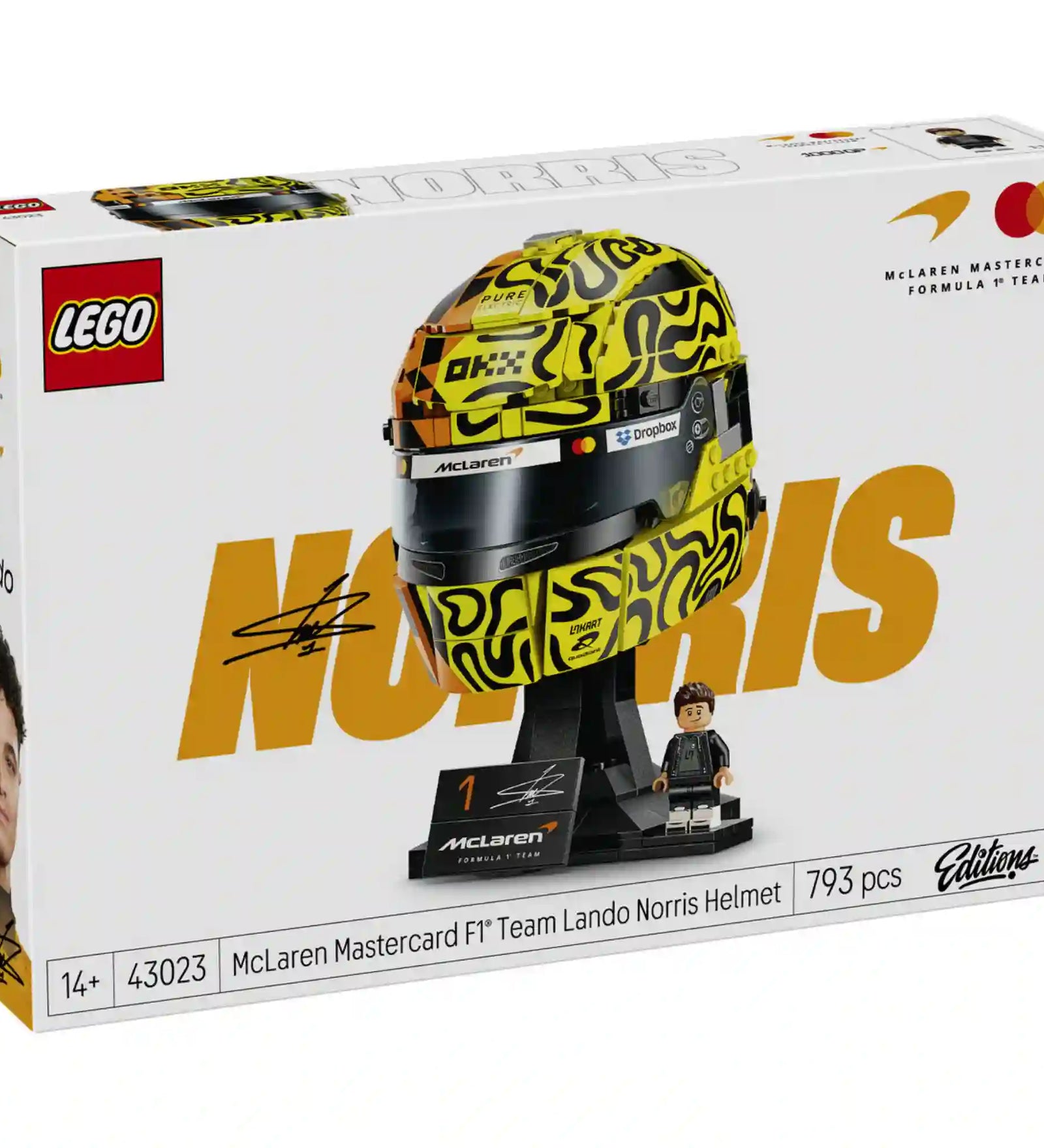LEGO McLaren Mastercard F1 Team Lando Norris Helmet (43023) készlet elölnézeti dobozképe a részletgazdag versenysisakkal, Lando Norris aláírásával és a McLaren Formula 1 Team arculatával.