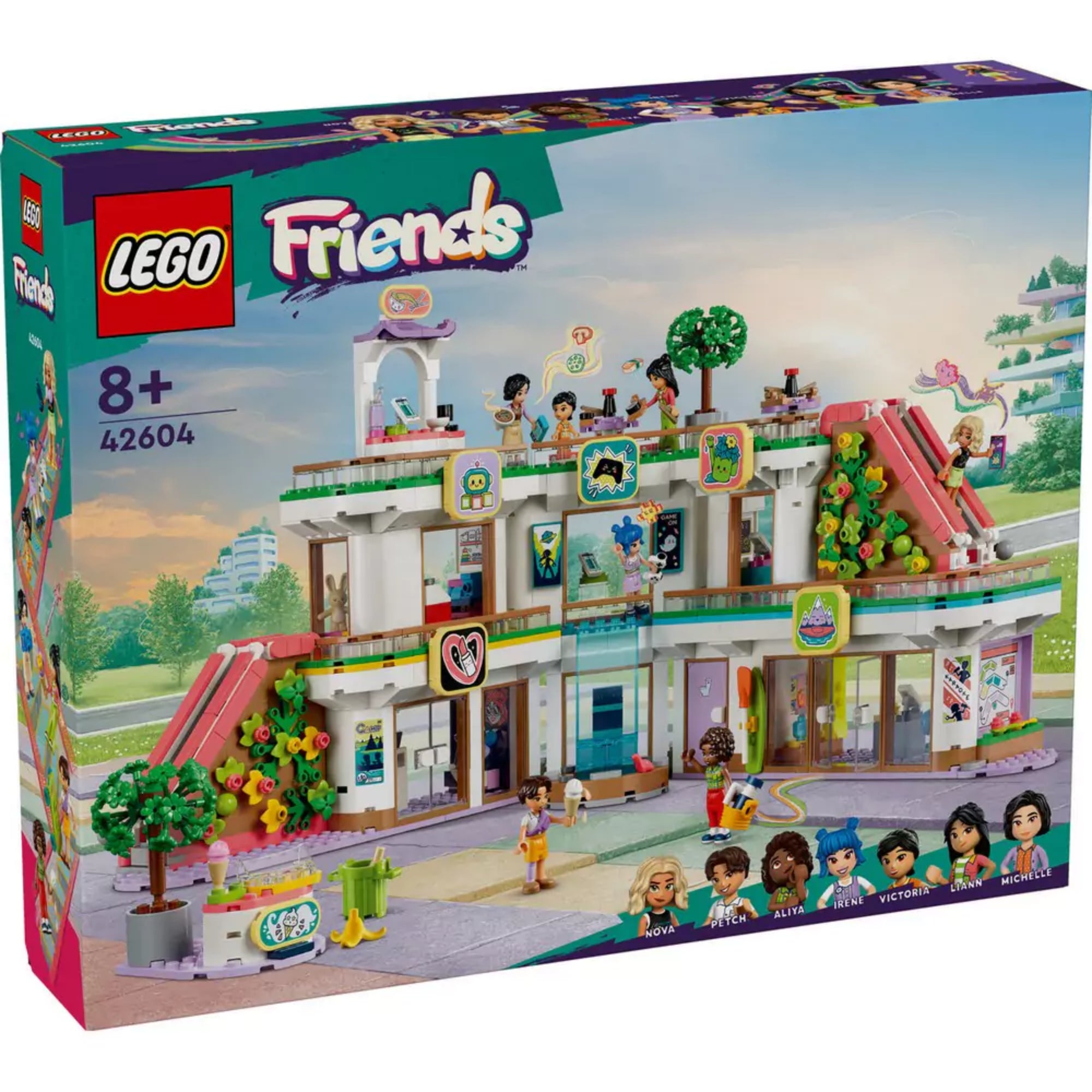 LEGO Friends Heartlake City bevásárlóközpont (42604) doboza – színes, városi háttérrel, a készlet építménye és a 7 szereplő (Nova, Peter, Aliya, Irene, Victoria, Liann és Michelle) látható a doboz elején, 8+ korosztályjelzéssel.
