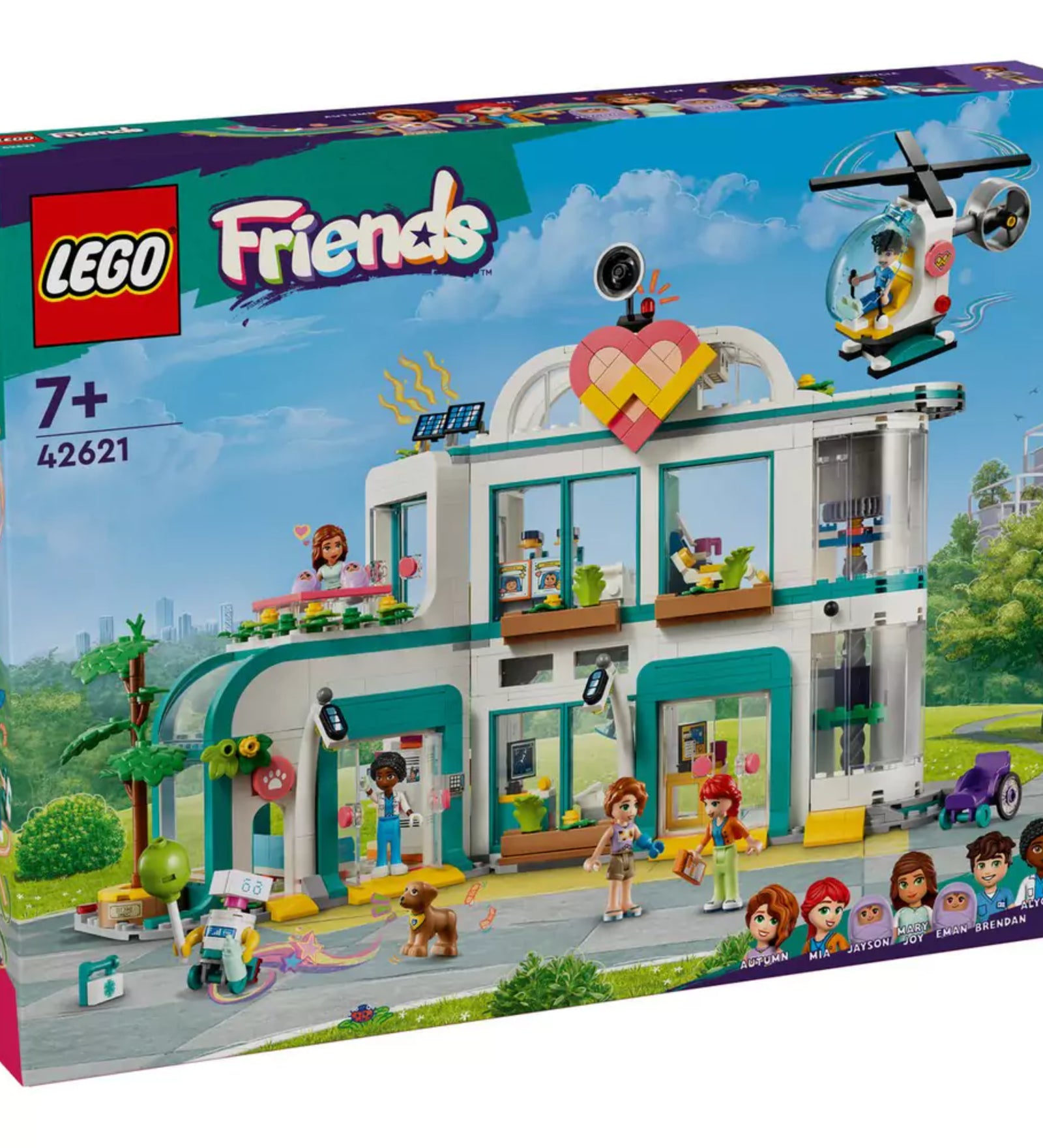 A LEGO Friends Heartlake City Kórház (42621) színes doboza a készlet tartalmával, karakterekkel és a város háttérrel.