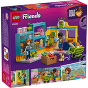 LEGO Friends Heartlake City Mini Supermarket (42680) hátoldali dobozkép játékelemekkel és belső boltberendezéssel.