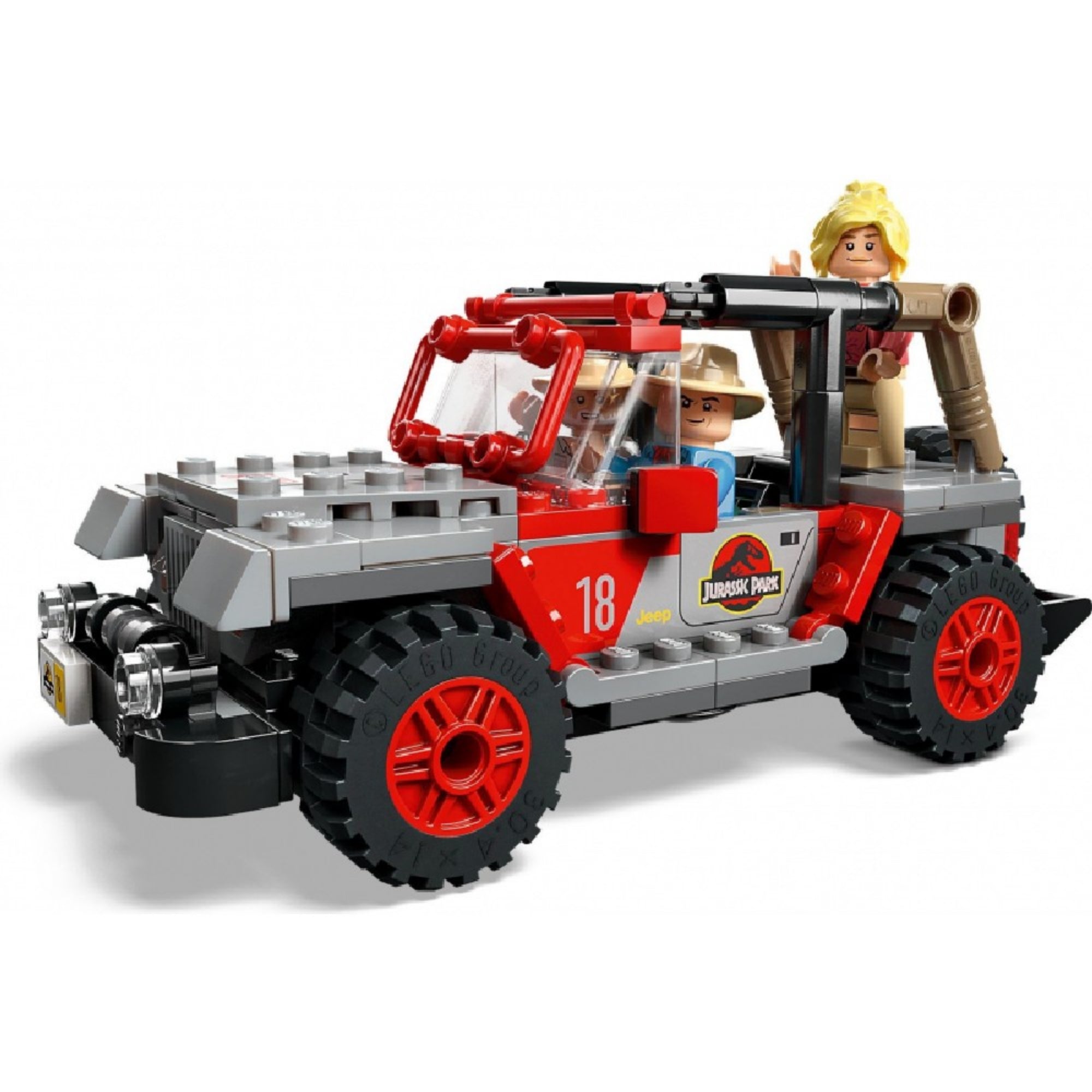 Közelkép a LEGO terepjáróról: piros-fekete színű, nyitott tetejű dzsungeljáró, amely hátsó részén felszereléssel van ellátva, a Jurassic World témához illően.