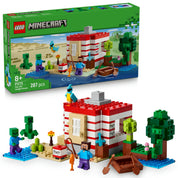A LEGO Minecraft 21275 készlet doboza és az elkészült dzsungelház modell, piros-fehér csíkos falakkal, zombikkal, hajóval és papagájjal.