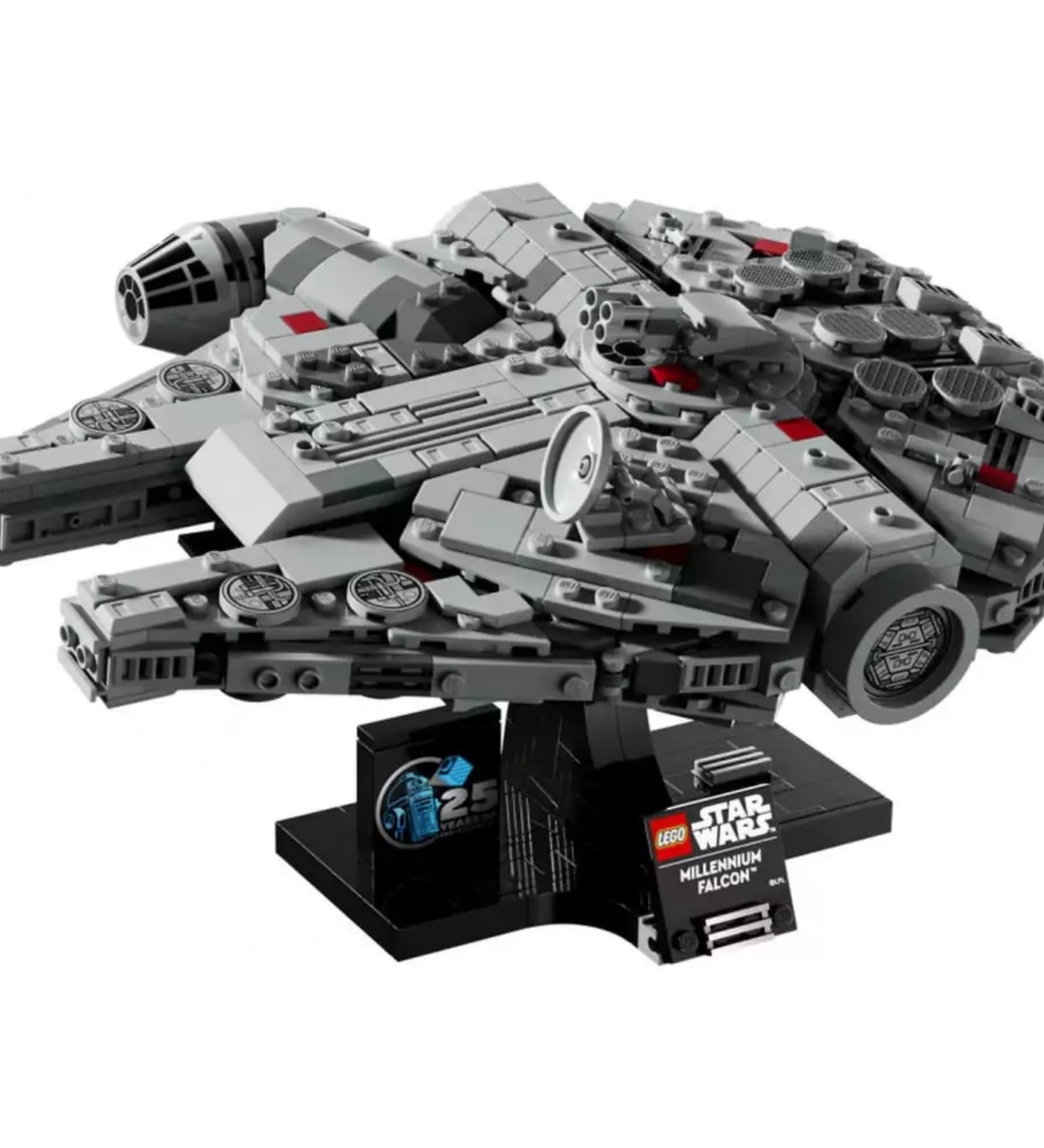 A LEGO Star Wars Millennium Falcon (75375) készlet összerakott hajója sötét kiállítóállványon, részletes kidolgozással, ikonikus kerek formával, szürke és sötétszürke elemekből, finoman elhelyezett piros díszítésekkel és a kiállítótáblán jól látható 25. évfordulós emblémával.