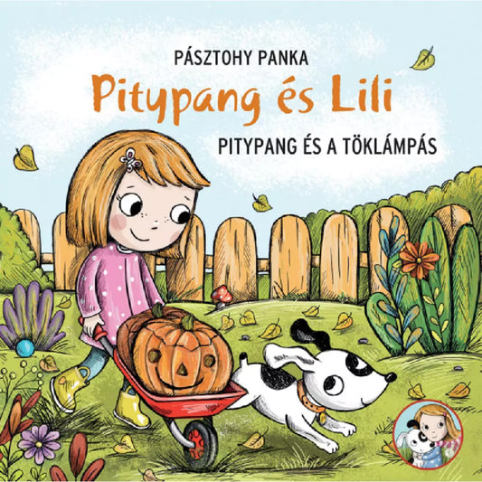 Pitypang és Lili – Pitypang és a töklámpás című magyar nyelvű mesekönyv borítója, Lili talicskában vidám töklámpást tol, mellette ugrándozik Pitypang kutya.