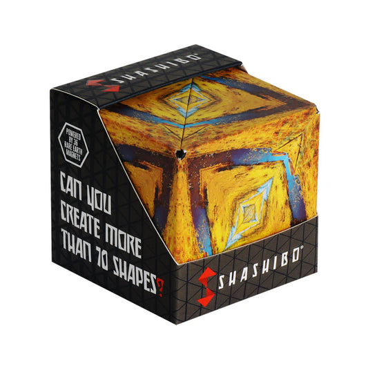 Második kép: A Shashibo Savanna átalakítható kocka doboza, élénk, naplemente-hangulatú mintával és a „Can you create more than 70 shapes?” felirattal.