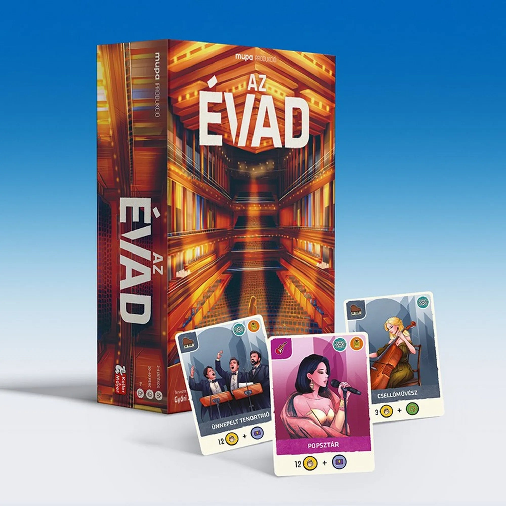 Az Évad társasjáték doboza három előadókártyával: ünnepelt tenorsztrió, popsztár és csellóművész a doboz előtt elhelyezve.