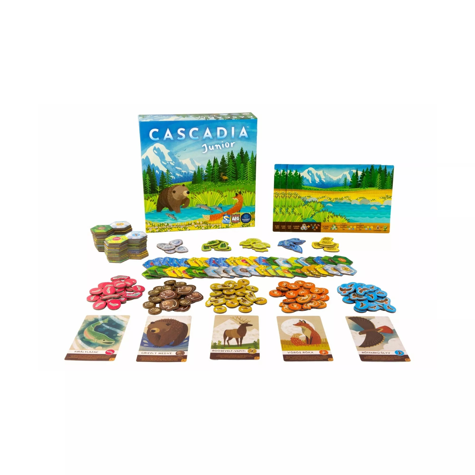A Cascadia Junior társasjáték kibontva: játéktábla, állatkártyák, színes jelölők és hatszögletű lapkák rendezve az asztalon.
