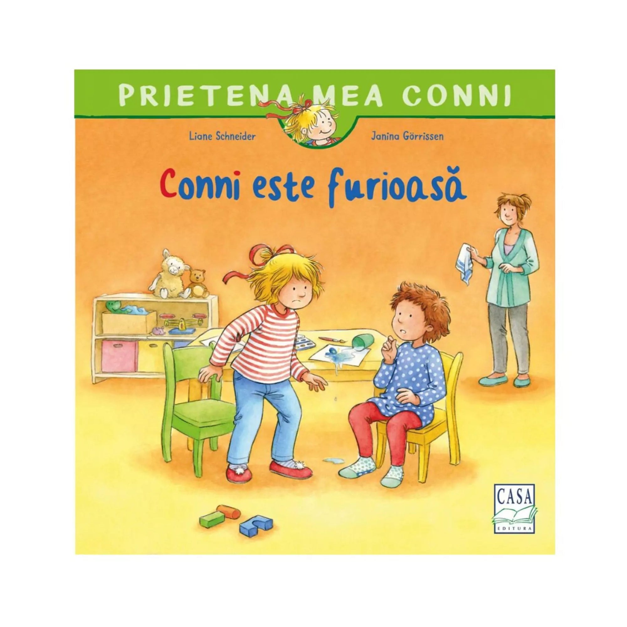 A könyvborító látható a képen: „Prietena mea Conni – Conni este furioasă”. A rajzolt illusztráción Conni dühösen áll egy zöld szék mellett, vele szemben egy kisfiú ül sárga széken, miközben egy felnőtt nő mosolyogva figyeli őket a háttérből.