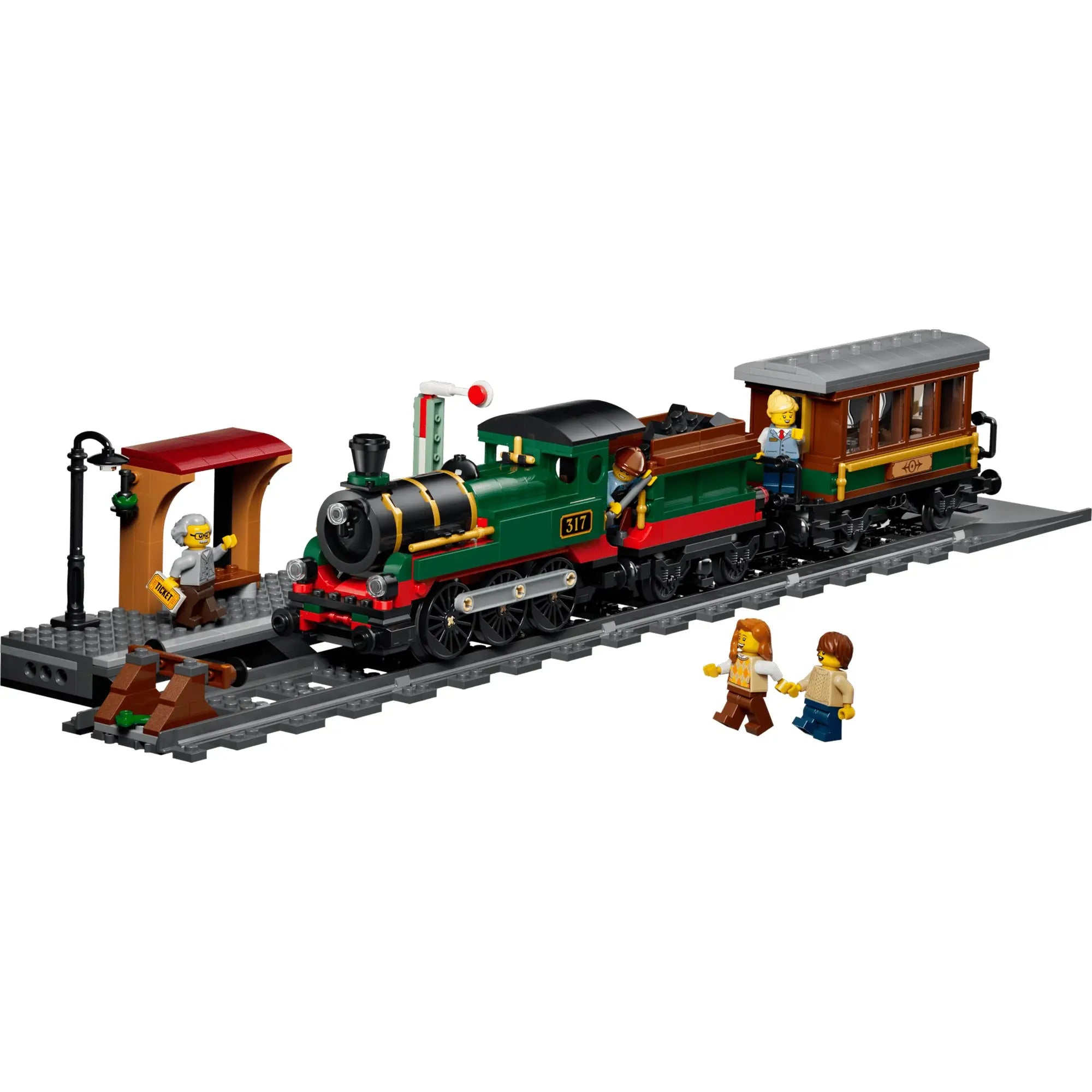 LEGO City Veterán gőzvonat 60511 készlet zöld gőzmozdonnyal, személykocsival, állomásperonnal és minifigurákkal vasúti pályán.