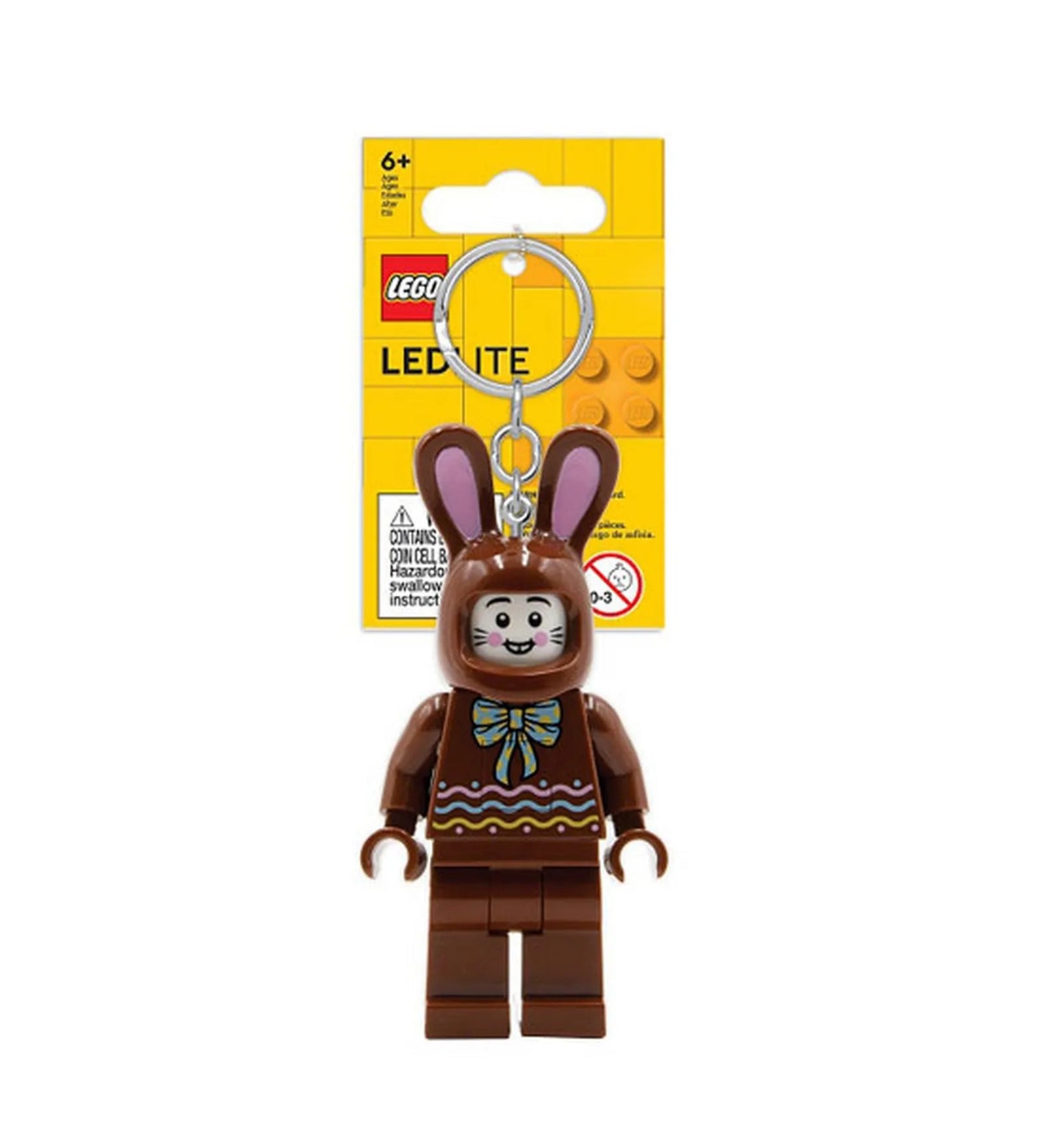 A LEGO Csokoládé nyuszi LED kulcstartó (LGL-KE180H) előlnézetből, eredeti csomagolásban, sárga háttérrel és fém kulcskarikával.