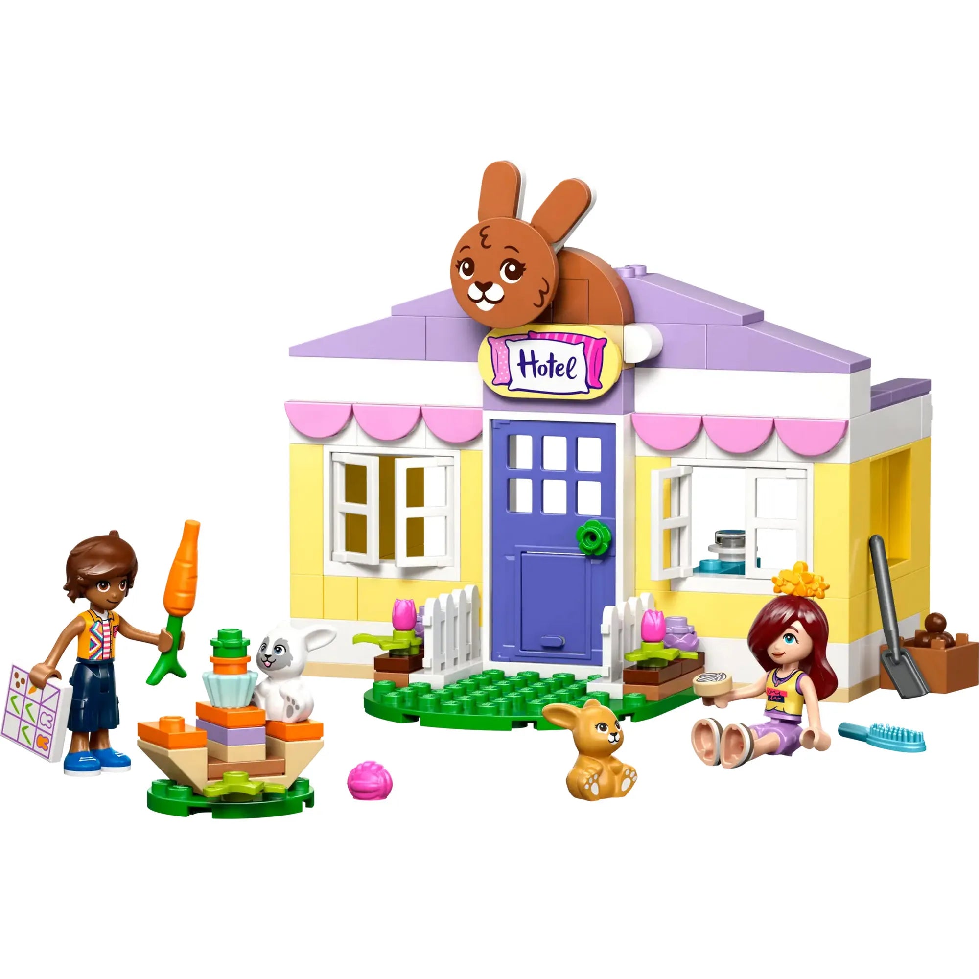 LEGO Friends Heartlake City nyuszipanzió (42679) teljes készlet fehér háttéren, épülettel, figurákkal és kiegészítőkkel