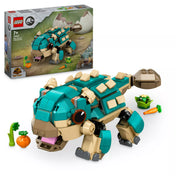 „A LEGO Jurassic World 76962 Bumpy bébidínó – Ankylosaurus készlet doboza a megépített dínófigurával és a mellékelt zöldségkiegészítőkkel együtt, fehér háttér előtt.”