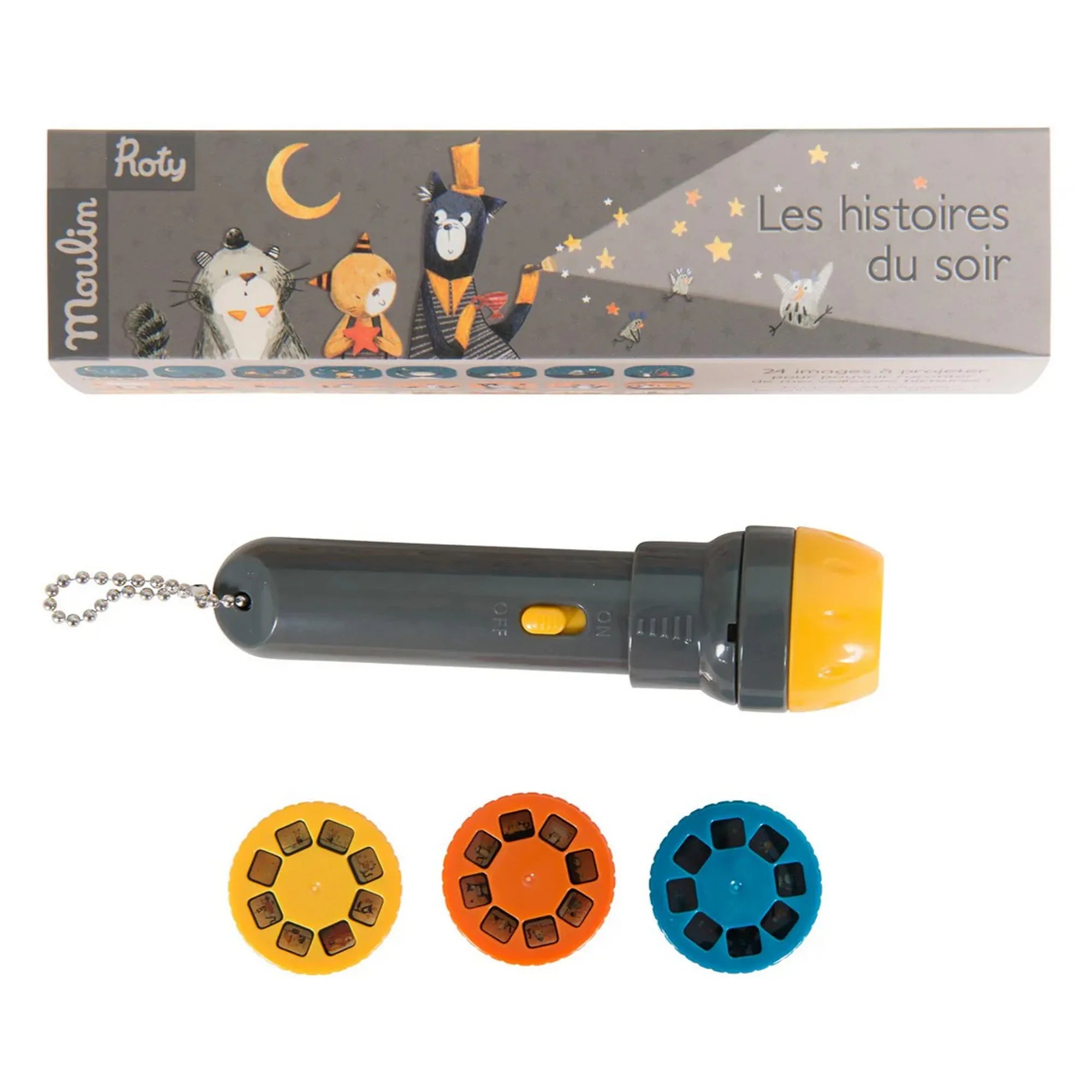 Moulin Roty Macskabajusz – a készlet tartalma: szürke-sárga vetítő és három színes dia korong a mesék vetítéséhez, a díszdoboz előtt elhelyezve.