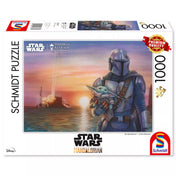 Schmidt Puzzle Thomas Kinkade Star Wars The Mandalorian dobozkép, 1000 darabos kirakó prémium minőségben, Din Djarin és Grogu (Baby Yoda) naplementében, Star Wars logóval.