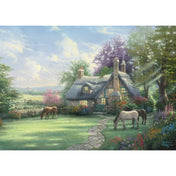 Puzzle Schmidt: Thomas Kinkade, Egy tökéletes nyári nap, 500 darabos kirakó képe, hangulatos vidéki kunyhóval, napsütötte kerttel, virágágyásokkal és békésen legelésző lovakkal a nyári tájban.