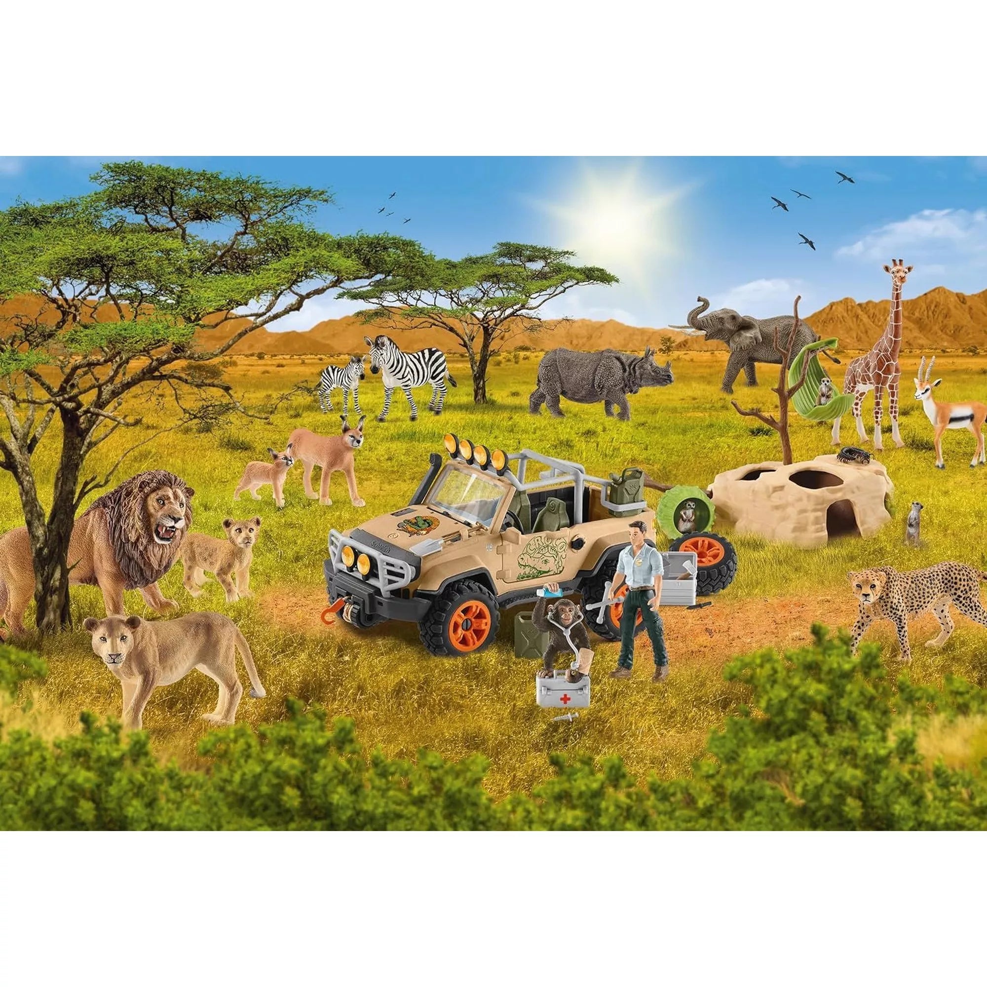 A Schleich Wild Life 60 darabos kirakott puzzle részletgazdag szavannai jelenete, oroszláncsaláddal, zebrákkal, elefánttal, zsiráffal, gepárddal, terepjáróval és állatmentő figurával a napsütötte afrikai tájon.
