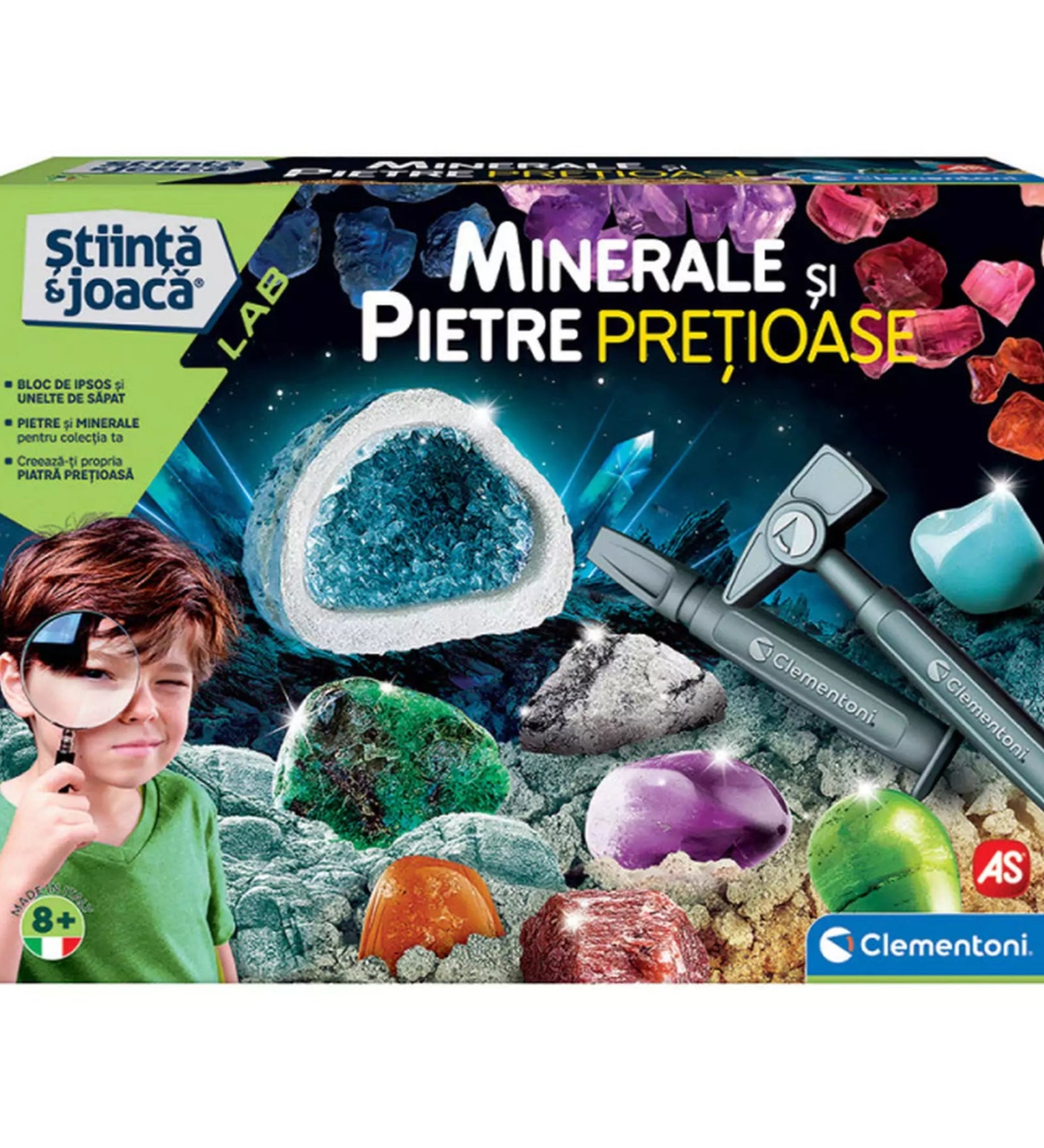 A Minerale și Pietre Prețioase tudományos játékkészlet színes doboza, melyen egy kisfiú nagyítóval figyeli a különféle drágaköveket és ásványokat, a háttérben pedig ragyogó kristályok és feltáró eszközök láthatók.