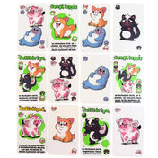 Közelkép a Sunyi szelek kártyáiról, amelyeken vidám, rajzfilmszerű állatok szerepelnek – például kutya, tehén, fóka és borz –, mindegyik humoros felirattal és külön funkcióval.