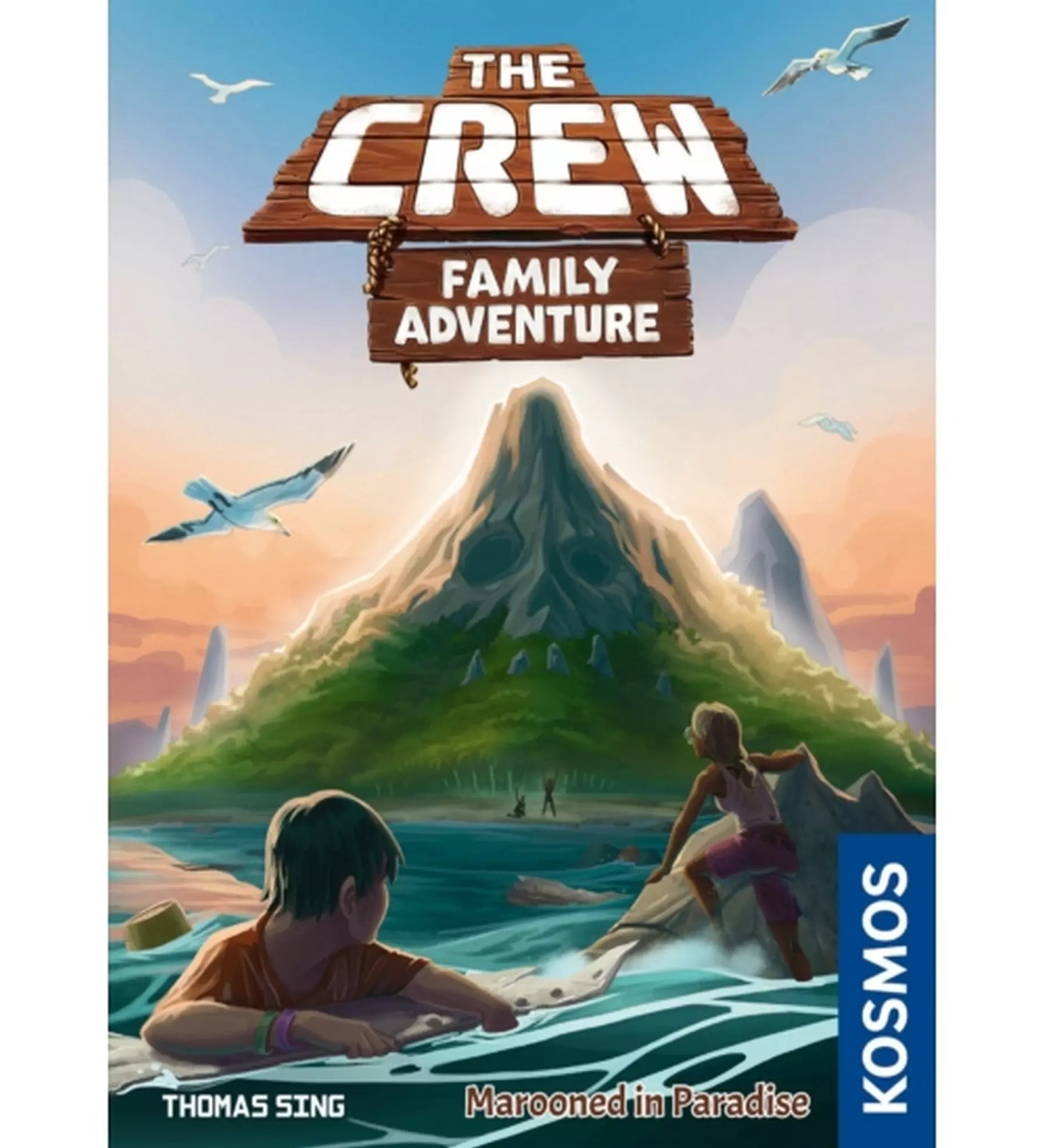 „The Crew Family Adventure társasjáték doboza, amelyen gyerekek láthatók, ahogy egy lakatlan sziget felé eveznek, háttérben egy koponya alakú hegy emelkedik.”