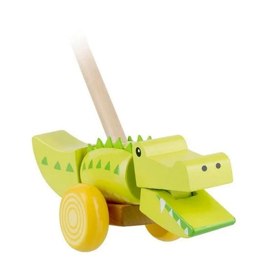 Tologatható krokodil – Orange Tree Toys fa tologatós játék krokodil formában, vidám zöld színben, kerekekkel és fogantyúval.