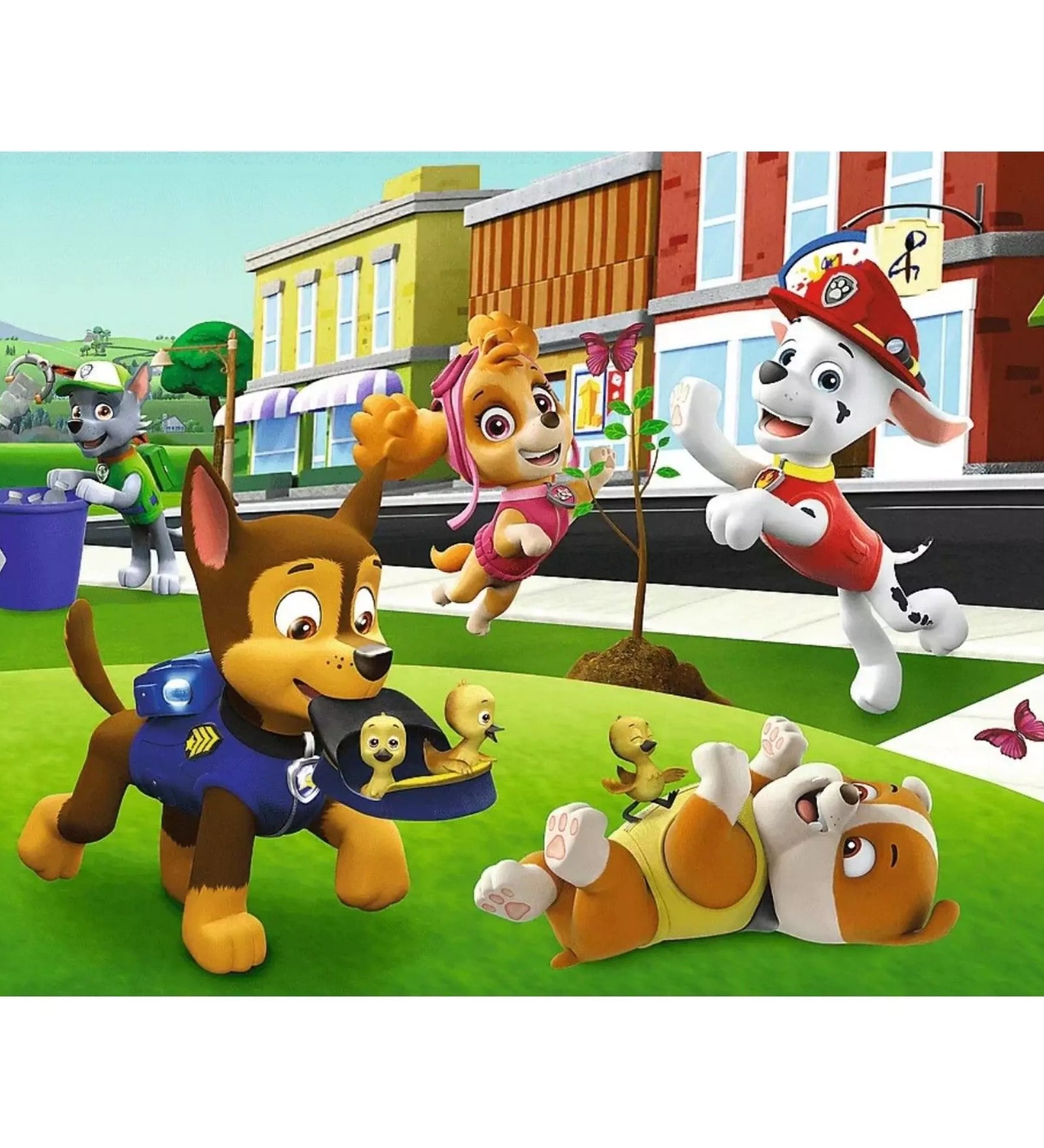 A kirakott puzzle képe, amelyen Chase, Skye, Marshall és Rubble vidáman játszanak egy parkban.
